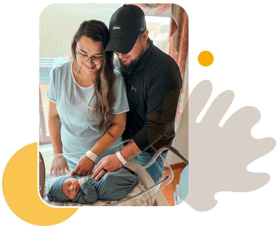 n_m_princeton-community-hospital-entrance-hp2 image decoration - mother, father and newborn baby